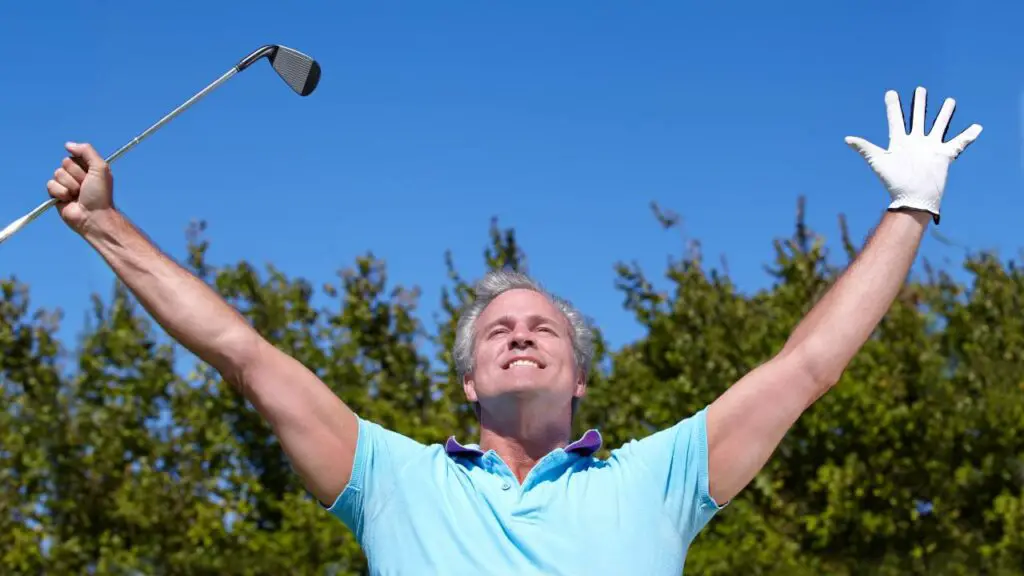 Golfer celebrating a hole in one