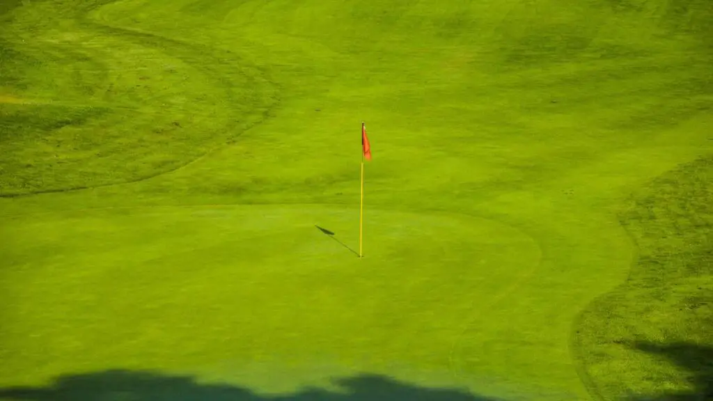 Hole flag on golf green on golf course