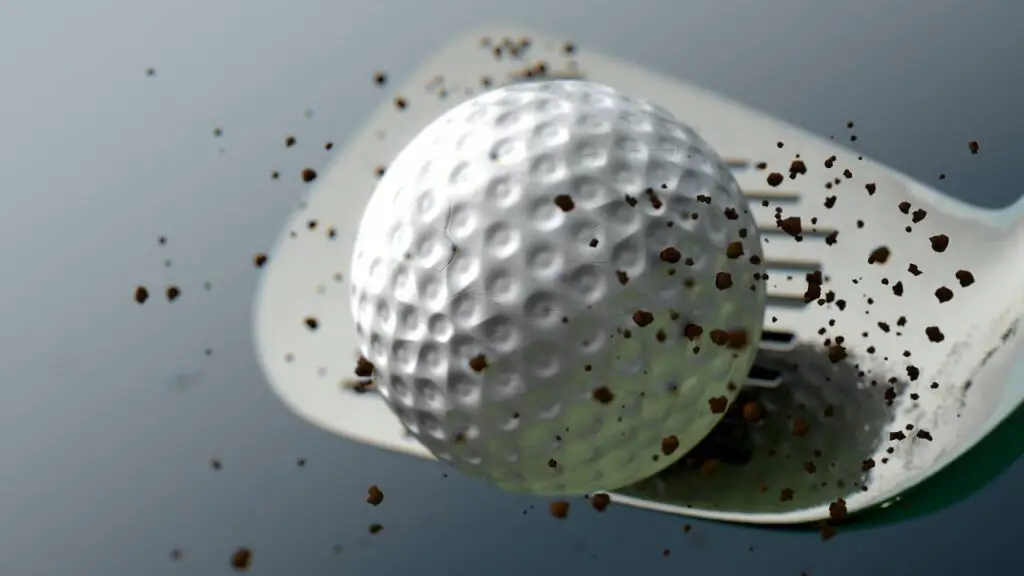Golf wedge hitting golf ball
