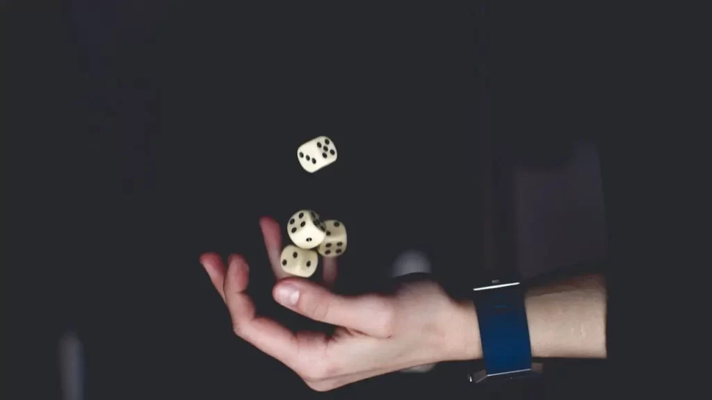A pair of dice being juggled in mid-air