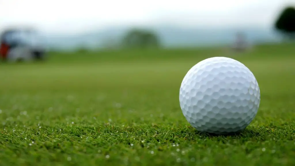 Golf ball on golf course green