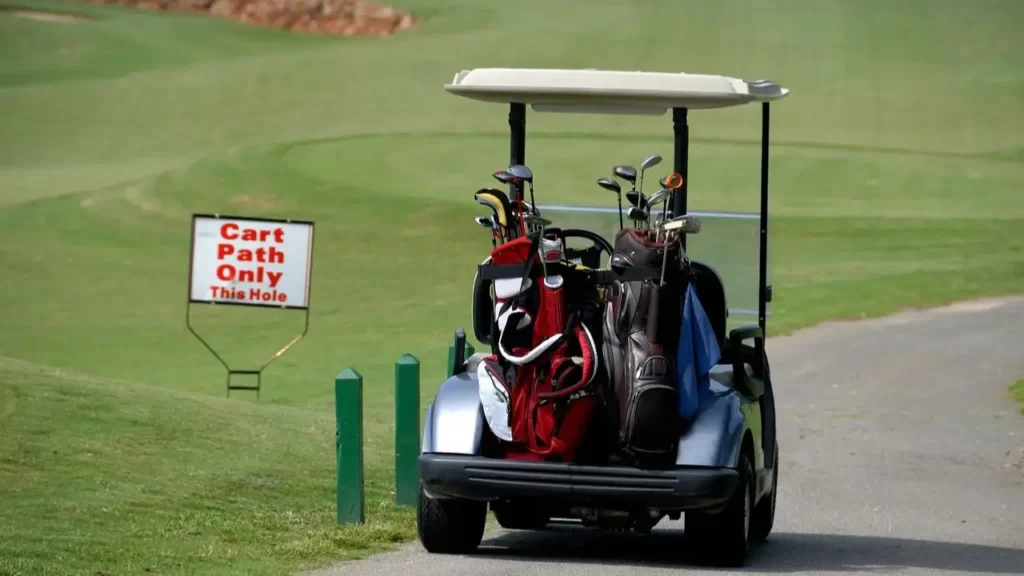 Golf cart on golf course path