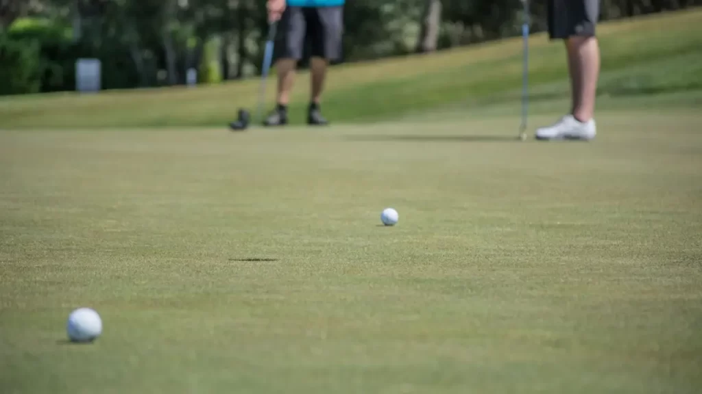 Golf ball on the way to hole