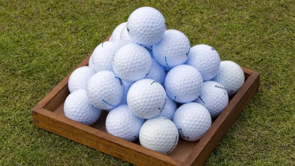 Golf balls sitting in golf ball tray