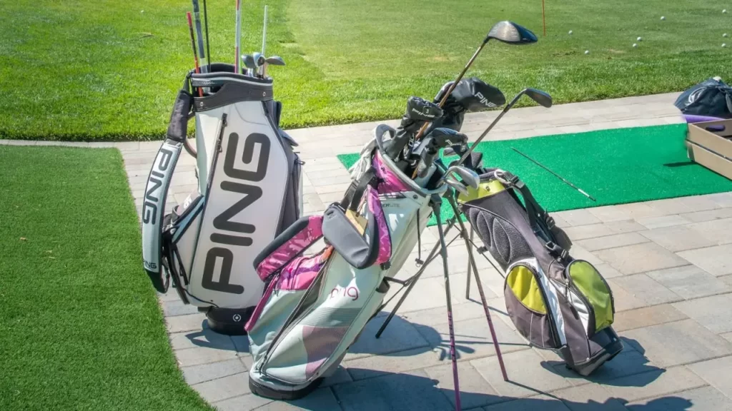 Golf stand bags with golf clubs inside