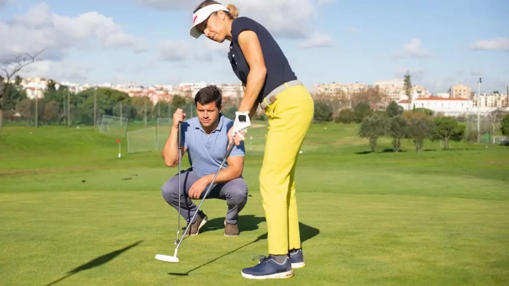 Female golfer putting a shot