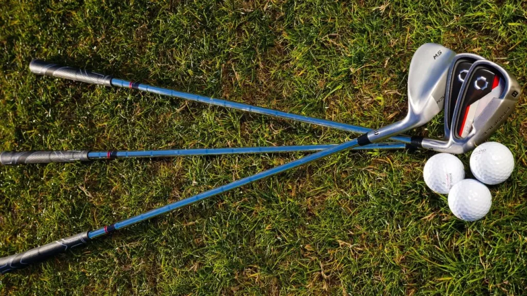 Golf wedge lined up on the green grass