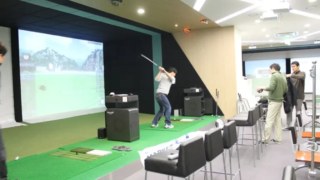 Golfer using a golf simulator