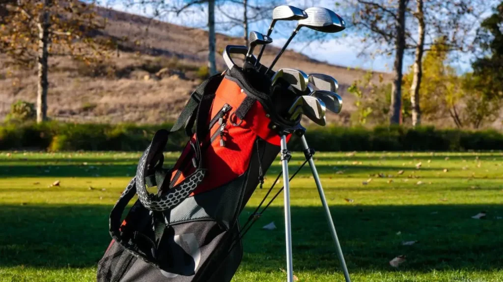 Golf bag with golf clubs in it on golf course