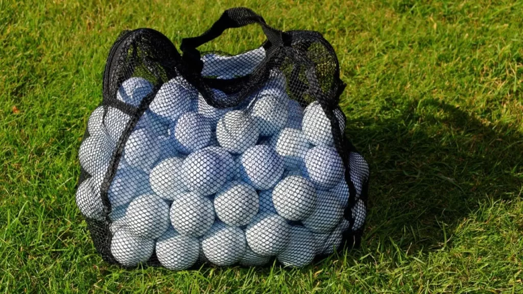 Golf balls in golf ball bag on golf course