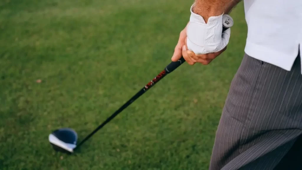 A pov of a golfer's hands holding a golf club grip