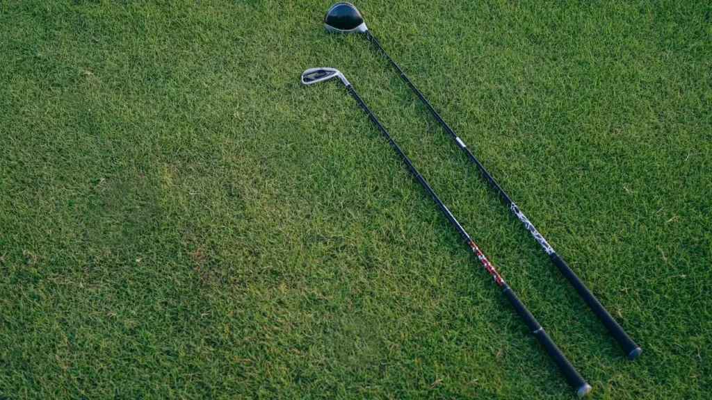 Two golf irons on the golf green