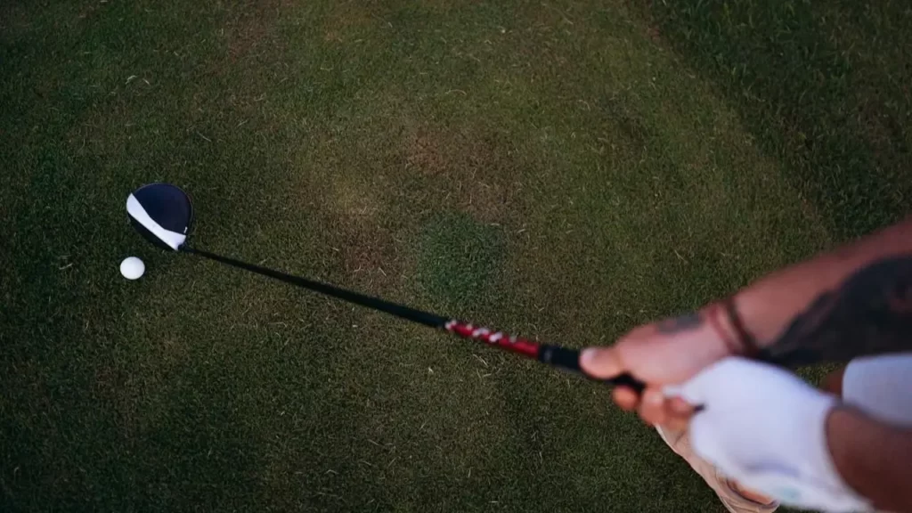 View from above the golfer's hands holding a golf club grip